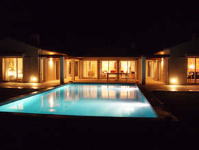 Villa with pool at night