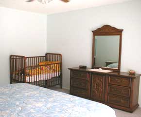 villa bedroom with cot